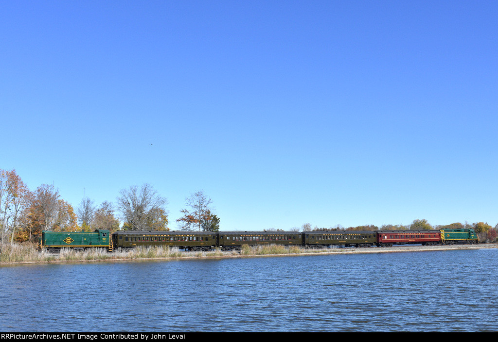 SMS Baldwin S-12 304 leads the passenger photo charter through Mannington Twp. The Mannington Mills factory building is seen in the background.